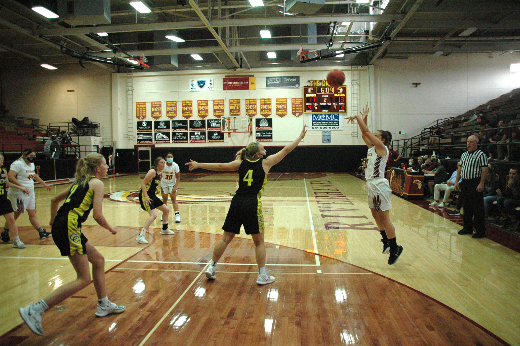 Natasha Muzechenko shoots a three-point jumper